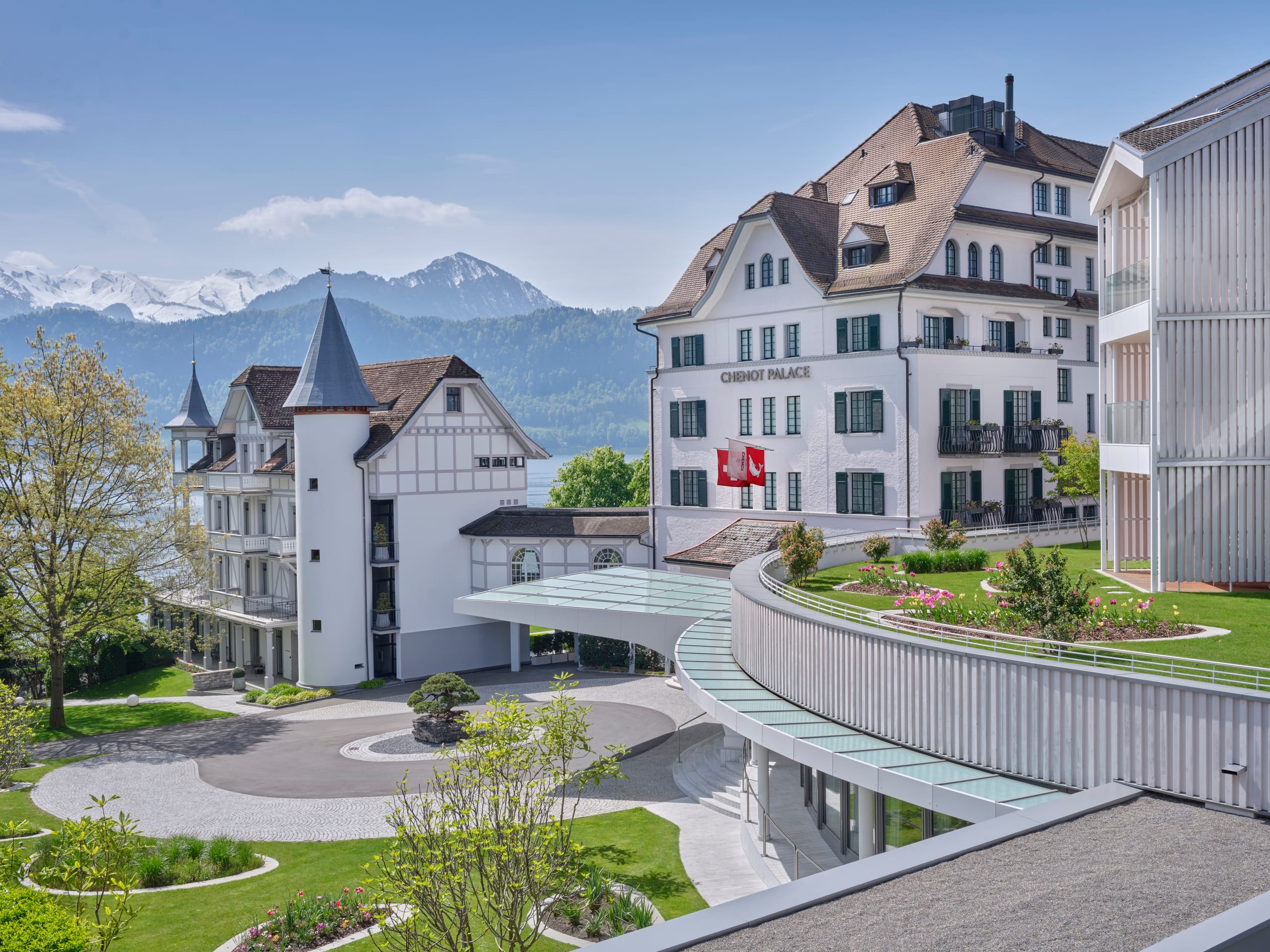 Chenot Palace Weggis historical building, with Lake Lucerne and mountains in the background