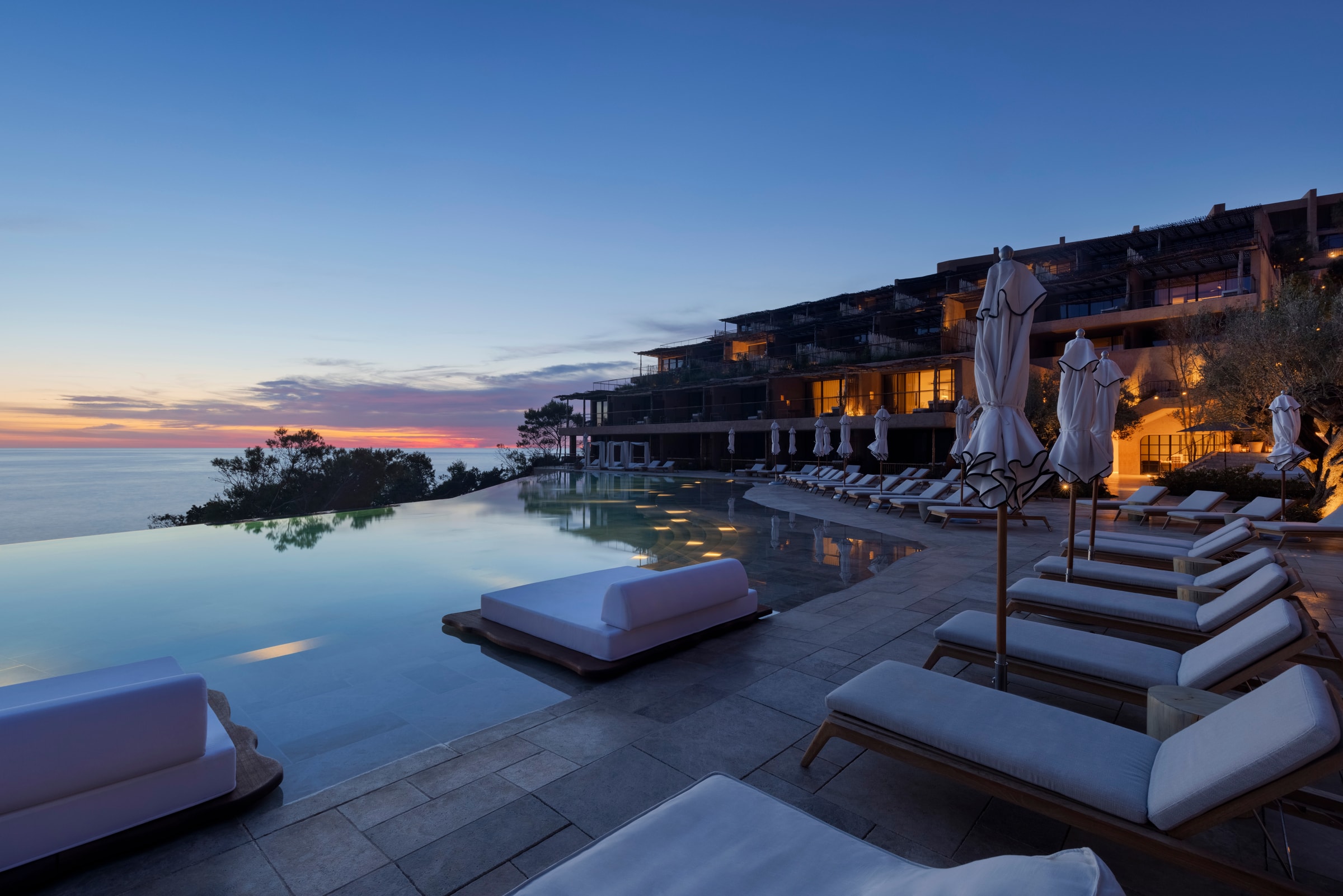 The swimming pool at Six Senses Ibiza at sunset, on the quiet northern coast at Cala Xarraca
