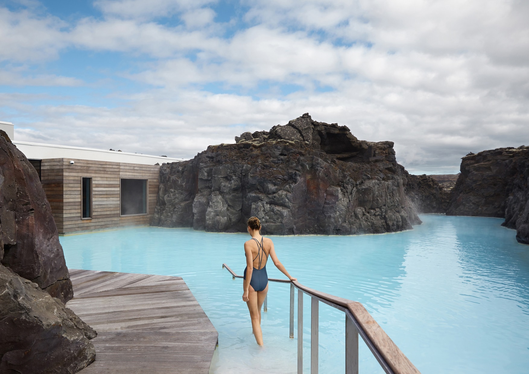 A guest walking into the private Retreat Lagoon at The Retreat at Blue Lagoon Iceland